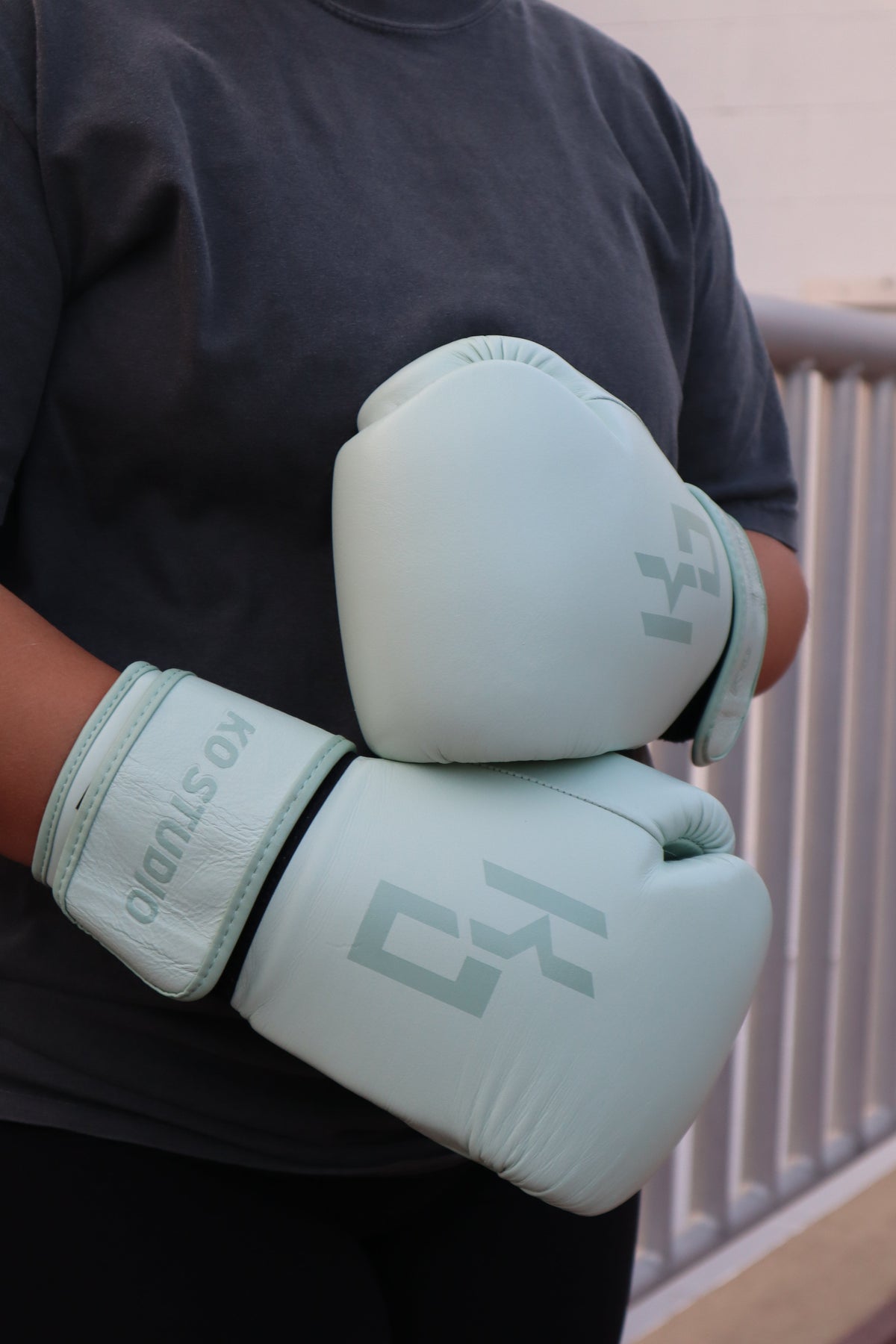 A woman training in KO Studio women's boxing gloves